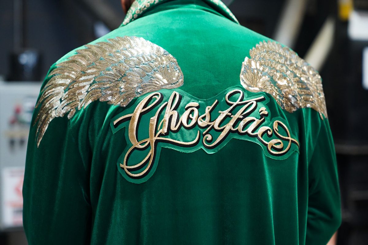 The back of Ghostface Killah's green velvet jacket with gold sequin wings and “Ghostface” embroidered in script, at the Killah Koffee roastery